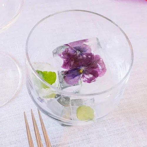 Decorate the table for May 17th with flowers and decorations in red, white, and blue